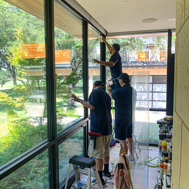 3 men installing Security Window Films